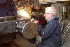 Tuesday, 10.2.15. Bob has welded the footplate edge to No. 6’s new buffer beam, and is grinding the surplus weld back …