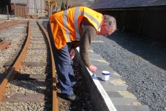 ... and Dick repaints the edge lines to the South Platform and steps that are unlikely to be used today - all ready for Easter.
