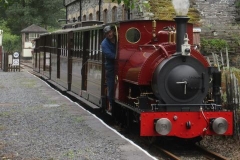 With all four carriages in tow, Patrick Keef drives the first test complete passenger train towards Corris ...
