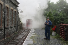 ...before the loco disappears in a cloud of steam as Patrick Keef pockets his phone after taking a photo of the loco in use.