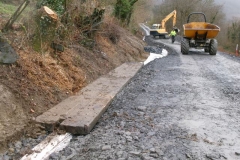 Friday, 5.4.2024. The boards are put to use, covering the drainage media so that vegetation and loose material can be scraped down on to them where the bank is too steep to create a practicable shelf, with the surplus material being taken away by dumper.