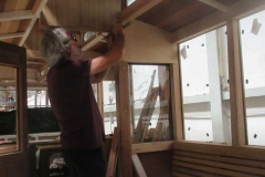 Robin is fitting sections around the vestibule of carriage No. 24 ...