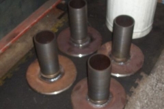 Meanwhile, in the Engine Shed, buffer heads have been welded to shafts …