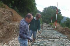 Friday, 12.6.2020. The rain forecast for the past two days has largely failed to materialise, so locally resident volunteers finish off levelling stone and stitching the lids down of the gabion baskets. That’s it – for a while.