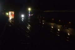The return (empty) train approaches in the dark - an opportunity to practice giving (and receiving) hand signals at night!