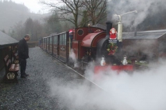 ... and once they have seen Santa, Trefor watches closely as the penultimate Up train departs ...