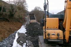 ... followed by pulling geotextile over the new drainage media and a quick flurry of fill being delivered ...