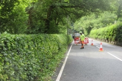 With the area subject to traffic control, advantage was taken by volunteers to trim fresh growth from our hedge which the contractor kindly cleared up!