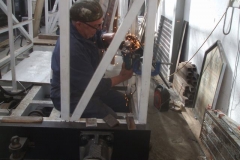 He then makes adjustments to the second tip-up seat fabrication in the Guard’s compartment of carriage No. 24 ...