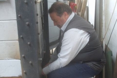 ... while Bill milks it as he and Mark (inside) bolt floor planks down in the P Way van.