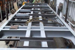 … and floor support angles have been prepared for both sides of carriage No. 24, and one side has been welded in position.
