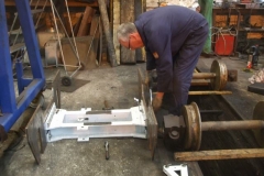 By mid-afternoon, the bogie side frames are being checked prior to trial fitting on the new wheelsets and axlebox assemblies …