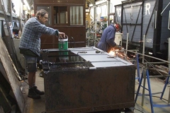 … Tony moves on to paint the underside of the Drop Side waggon body with black bitumen ...