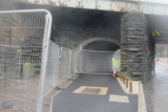 Saturday, 16.12.2023. In Machynlleth, the Tramroad arch works are essentially complete, but traffic control measures in connection with the new bridge means it is cordoned off until the bridge opens.