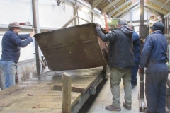The skip bodies for waggon No. 203 are loaded by hand onto 218 and transferred to the Carriage Shed ...
