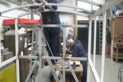 Tuesday, 19.5.15. It’s all action in the Carriage Shed as Phil paints the roof steel work on carriage No. 23, while Neil, Tony & Bill address No. 22’s wood work.
