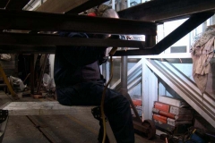 Opposite, Adrian adopts a comfortable position for welding (all day)!