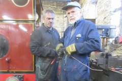 Back in the Engine Shed, Trefor and Dave are amending the pipework to No. 7's air pump (it having been temporarily used on No. 10) ...