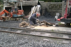 Outside, John is producing plenty of sawdust to create more morning sticks for No. 7!