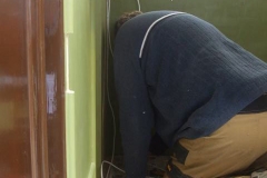 … and John fits wiring in the vestibule of carriage No. 23.