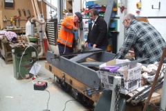 This requires holes to be drilled through the underframe, with Bill and Charles checking verticality in two planes …