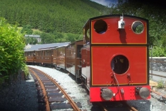 Saturday, 11.6.2022. No. 7 and train pose in the sunshine at the new station in Corris.