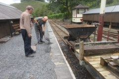 Tuesday, 12.9.2023. Peter and Dick are filling up behind platform edge stones to make good erosion caused by the passage of many feet ...