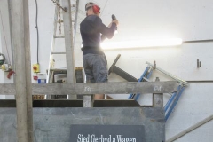 ... while Peter sets up the Carriage Shed Sponsor's board on the wall - a long overdue task!