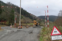 Tuesday, 20.2.2024. The goalposts warning of overhead cables at the site entrance have been completely refurbished while the excavator is used to increase the area available for stock-piling.