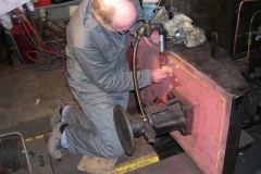 Monday, 23.2.15. Dave Mundy rubs down the front buffer beam of No. 7 prior to re-painting …