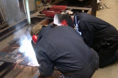 Adrian is welding an additional plate to one of No. 20’s buffer beams, closely observed by Bob …