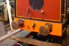 … painting the buffer beams of No. 7 in red undercoat.