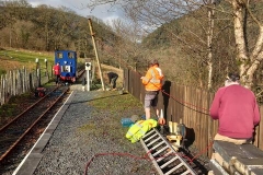 A team have been breaking out concrete to release the signal post for refurbishment and moving to another position.