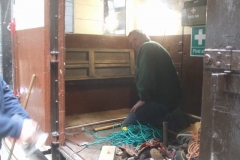 Elsewhere in the Carriage Shed, Mark and others clear away furniture to access body panels on van No. 204 ...