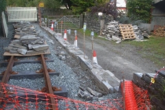 In Corris, the rebuilt section of railway wall is now at trackbed level ...