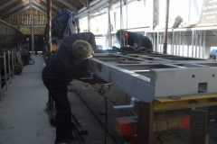 … while Pete primes and Adrian welds the underframes of carriage No. 24.