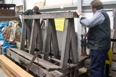 In the Carriage Shed, Neil and Bill manoeuvre themselves into position to start dismantling the trestle waggon …