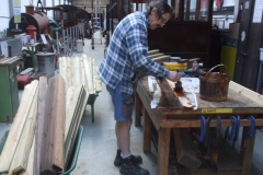 … while in the Carriage Shed, Tony is staining timber palings …