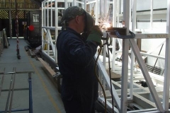 Adrian is back to welding brackets for handrails on carriages 23 & 24 …