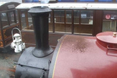 ... but the saddle tank needs some powdery rust (discharged from the chimney) blowing off it first!