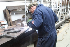 Adrian welds the last “coat hanger” for carriage No. 24’s roof …