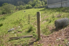 Outside, former gas main fencing is rolled up and posts removed ready for re-use on the railway …