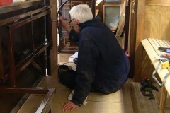 In the Carriage Shed, Phil is giving the folding seat frames in carriage No. 22 a coat of gloss paint.