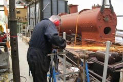 The drawbar was found to have a defect, repaired by Adrian and here being cleaned up.