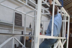 … while Tony paints the body framework of carriage No. 24 in the relative cool of the Carriage Shed …