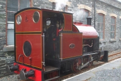 Later, after passing the boiler steam test, No. 7 gently simmers outside the Engine Shed …