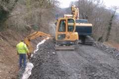 Tuesday, 26.3.2024. A smaller excavator has arrived to carefully clear over-spill from the geotextile ...
