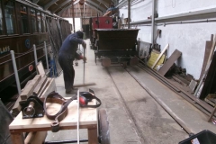 Tuesday, 26.3.2024. Adrian sweeps up after mounting the hoppers on waggon No. 203 ...