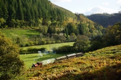 The train makes a fine sight heading up the valley through autumn colours – and sunshine!