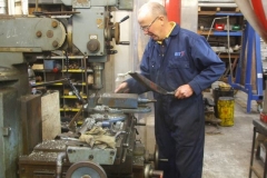 Tuesday, 22.10.2019. Chris cleans up after a quiet day of machining with Bob.